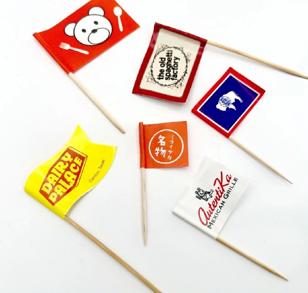 custom-restaurant-flag-picks-with-logo Custom-printed restaurant flag picks featuring branded logos for restaurants, diners, hotels, and hospitality businesses. Ideal for food presentation, menu identification, and promotional branding.